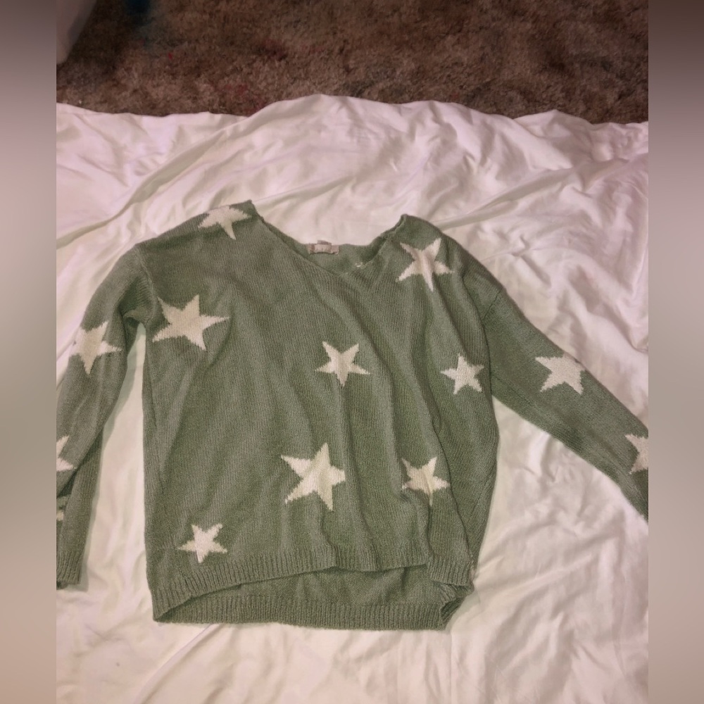 light green sweater with stars from alterd state